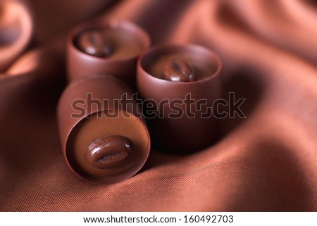 chocolates on a brown silk, close up