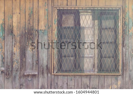 Old Vintage Style Window On Wall Covered With Wooden Planks