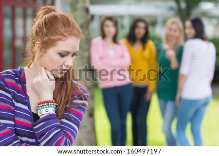Female student being bullied by other group of students Royalty-Free Stock Photo #160497197