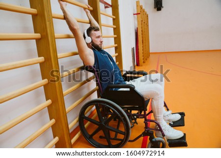 A man in a wheelchair trains indoors. Training concept for the disabled