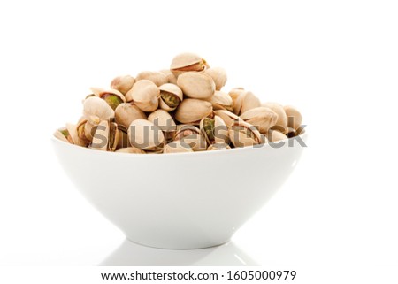Pistachios in a white bowl