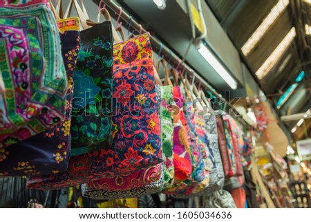 Handicraft elephants weave handbag selling at the market in Bangkok,Thailand.