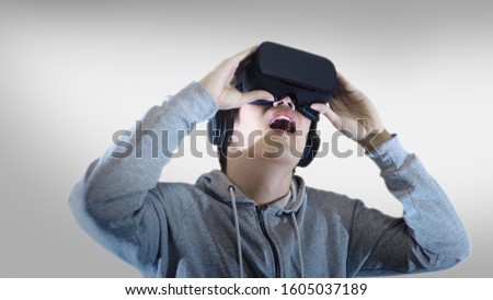 vr virtual reality with asian man feeling excited experience on white background