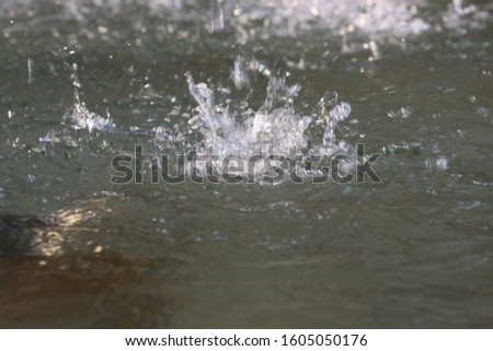 drop water flowing on surface