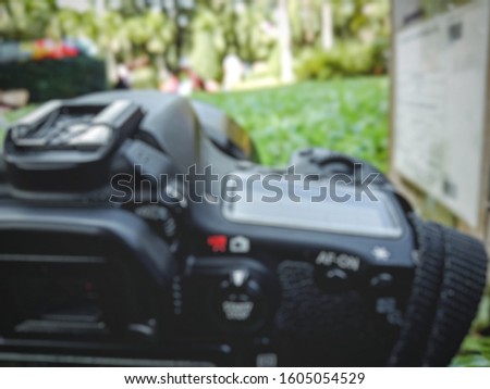 Camera blur on a natural green background