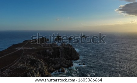 Aerial view of the sunset over ocean lagoon and the cliffs at the seascape of Pointe de Pen-hir, a promontory of the Crozon peninsula in Brittany (Bretagne), France