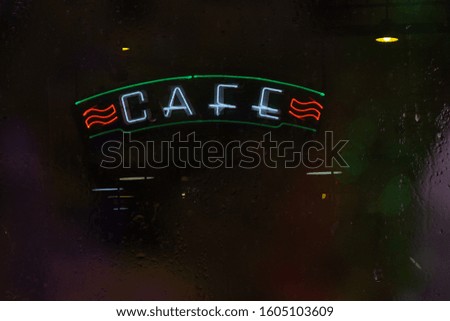 Retro Cafe sign in Wet Window