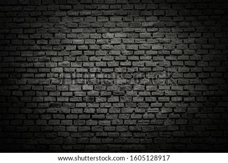 Old brick black color wall. Vintage background Royalty-Free Stock Photo #1605128917