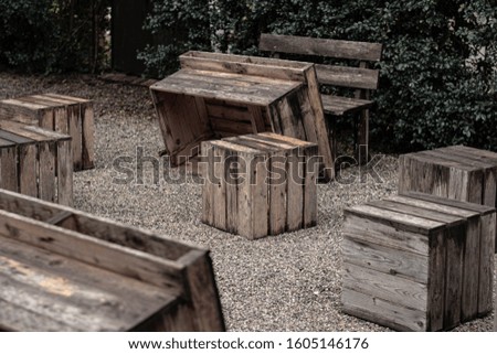 Beautiful relaxing setting of chairs and a glasses and a rock on the floor. lovely picnic for party with friends.