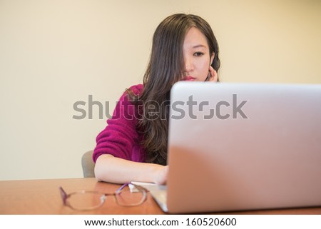 Young woman working and studying on a laptop