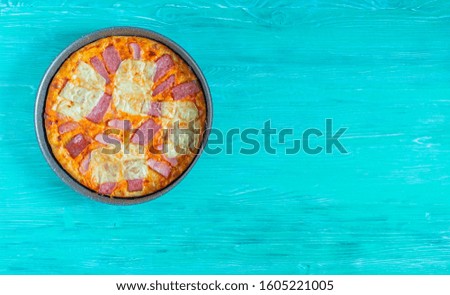 Pizza with cheese and ham. Photographed close-up.