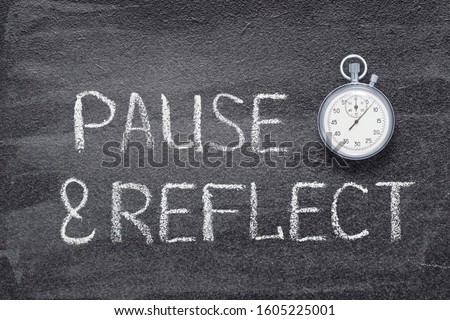 pause and reflect phrase written on chalkboard with vintage precise stopwatch 

 Royalty-Free Stock Photo #1605225001
