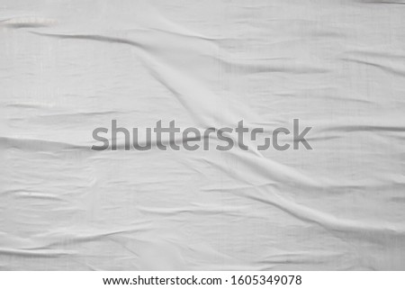 White waved crinkled creased wrinkled textured poster, creative paper idea Royalty-Free Stock Photo #1605349078
