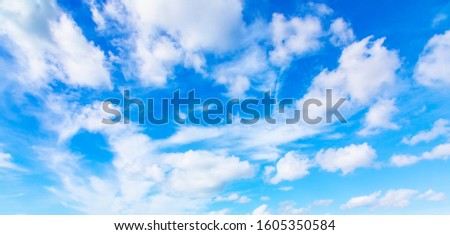 Wide panorama of blue sky and clouds, abstract natural background