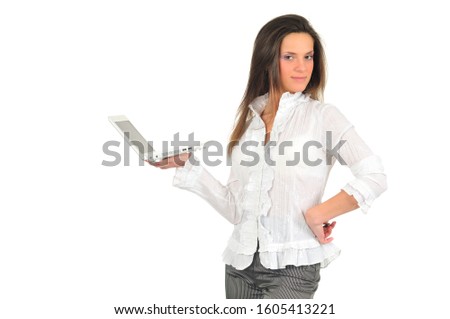 Young girl in white shirt holds white laptop in her hands. Isolated on white background