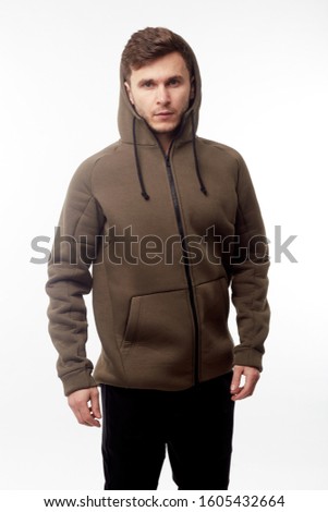Man wearing in khaki hoodie isolated on white background.