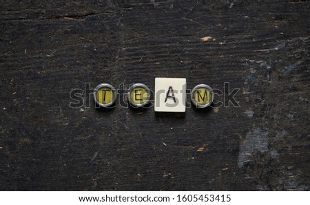 Typewriter keys and game pieces spelling motivational words