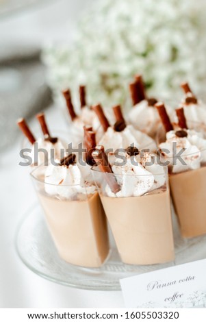 Coffee pana cotta in a transparent cup. Ideas for serving. Picture for a menu or confectionery catalog