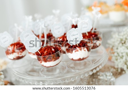 Red velvet cake, pastry mixed with milk cream, decorated by berries. Picture for a menu or confectionery catalog