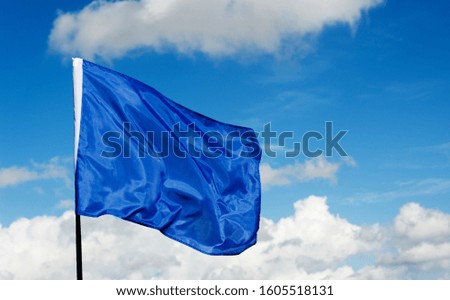 Blue flag waving on sky 