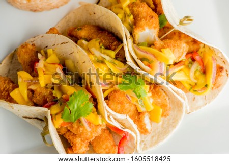 Fish Tacos. Tacos. Meat, fried fish, avocado, cilantro, cheese, homemade salsa, lettuce and lime slices. Tex-Mex favorite, Mexican street tacos: beef, fish, pork, served on homemade corn tortillas.