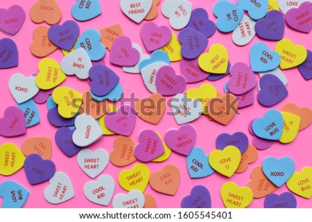 Colorful hearts on a pink background