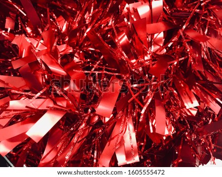 Red shining tinsel garland background. Abstract background, red backgroun