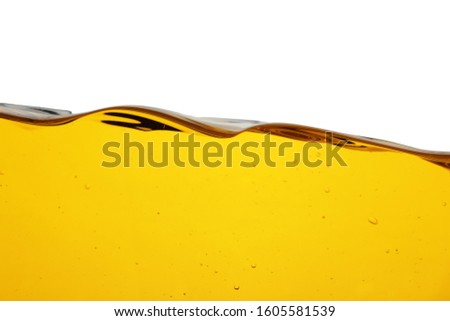 Cooking oil flow isolated on white. Color liquid