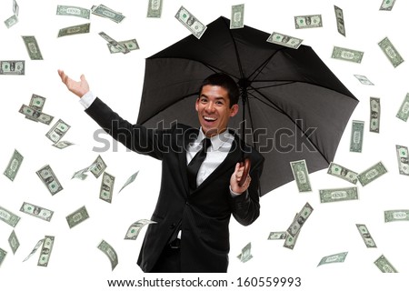 Businessman enjoying it raining money