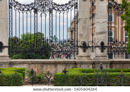 Marble columns with decorated ironwork gate near Buda Castle Budapest, Hungary