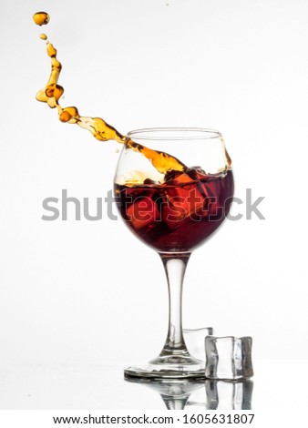 splashes of wine in an iced glass