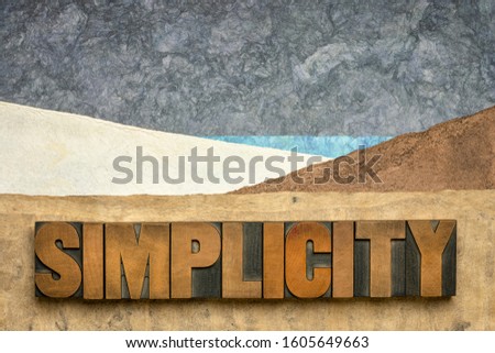simplicity word  in vintage letterpress wood type against abstract paper landscape, minimalism concept