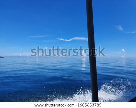 snap image of sea horizon and blue sky