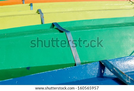 Colorful kayak boats, like rainbow pattern