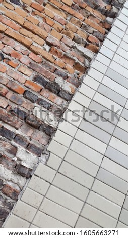 Brick wall. Bricks. Dirty brick surface. Vintage background for postcards