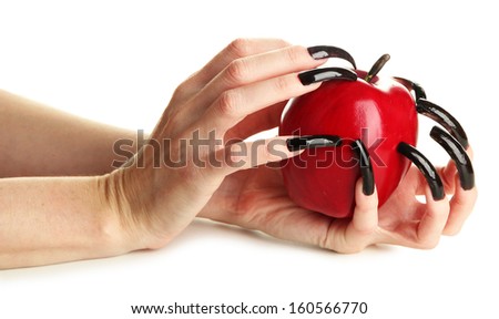 Hands with scary manicure holding red apple , isolated on white