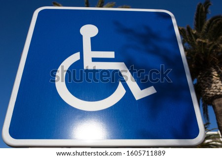 Sign for disabled parking close-up. A clear sunny day.