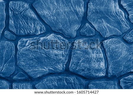 Trend toned trendy color 2020 classic blue monochrome background layout for design, top view. Concrete wall texture in blue tones. Postcard. Copy space - surface concept for lettering, text.