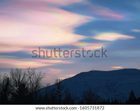 polar stratospheric clouds over tron mountain Royalty-Free Stock Photo #1605731872