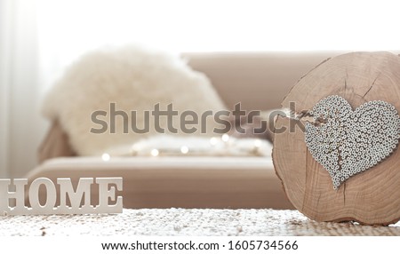 Still life in the living room with a wooden inscription home . The concept of home and comfort.