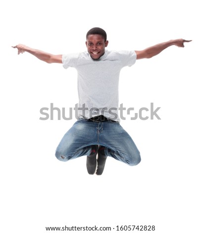 cheerful guy in glasses jumping high up . isolated on white