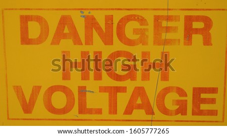 Red and yellow high voltage warning sign