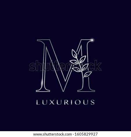 Outline Nature Leaves Initial Letter M logo icon. Silver vector design concept  isolation on blue background color for luxuries business.