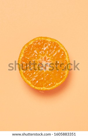 half fresh oranges on orange background. Royalty-Free Stock Photo #1605883351