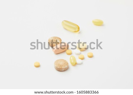 diffrent pills on white backgroud. Royalty-Free Stock Photo #1605883366