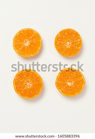 four half fresh orange on white background. Royalty-Free Stock Photo #1605883396