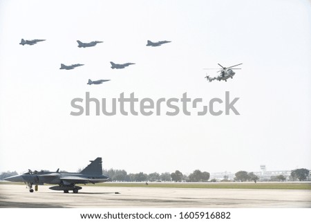 Combat aircraft practicing through the white background