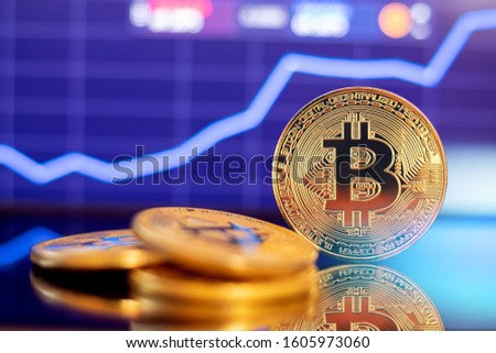 Gold Bitcoin crypto currency on background up growth chart diagram.