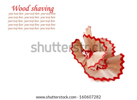 Red pencil and wood shavings isolated on white background