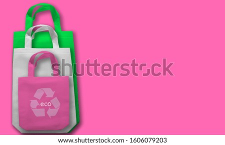 "eco with recycle icon" shopping bags on Hot Pink Color Background